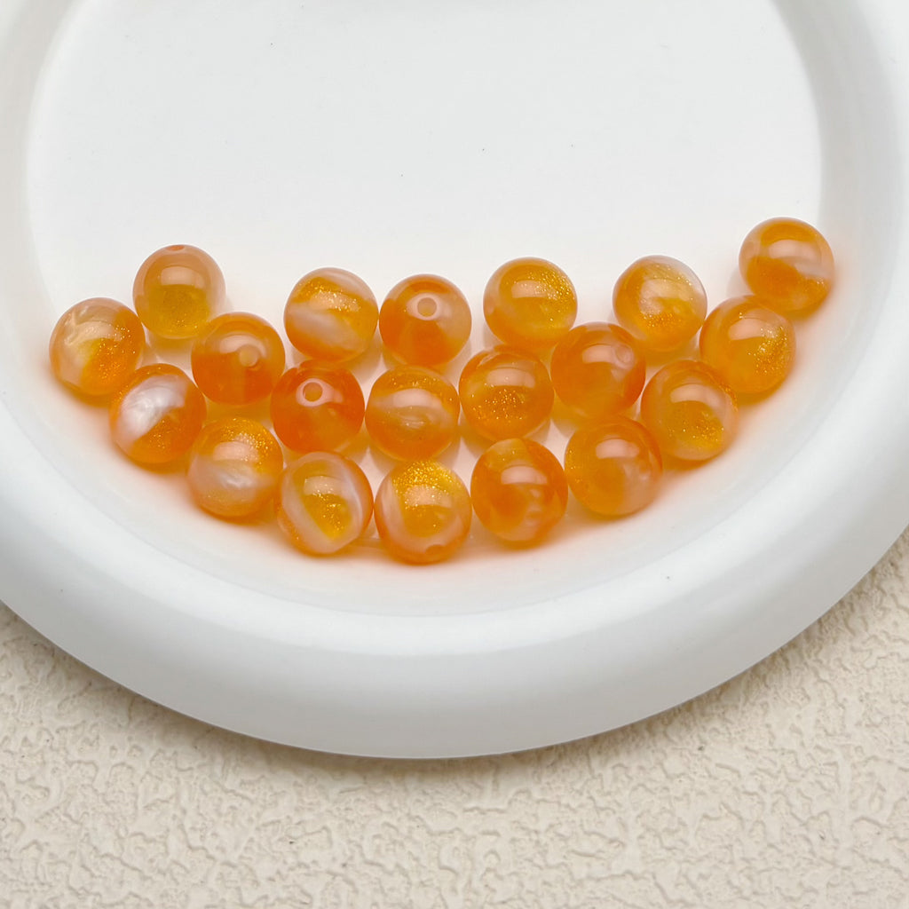 12mm | 紫外線で色が変わるビーズ（オレンジ→スモークブルー柄）