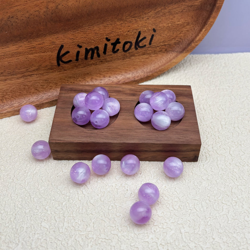 12mm | 紫外線で色が変わるビーズ（ラベンダー→ピンク柄）