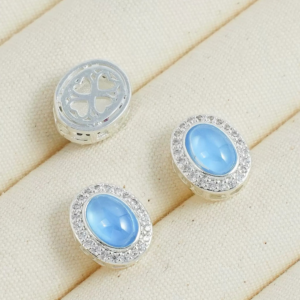 人工アクアマリンの楕円チャーム（ペンダント／スペーサービーズ）