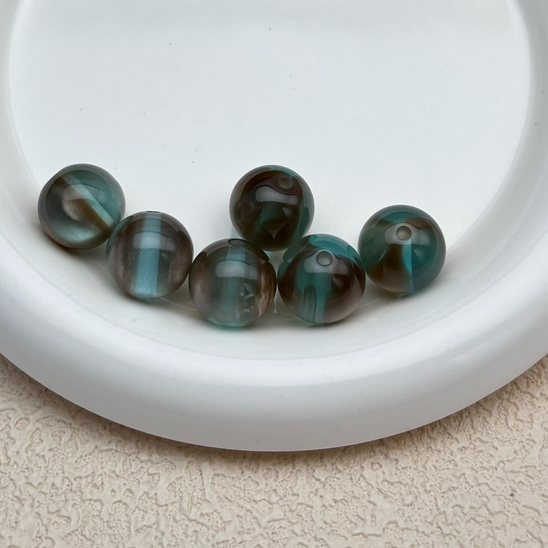 16mm | ダークゴールド x アイスブルーキャッツアイビーズ