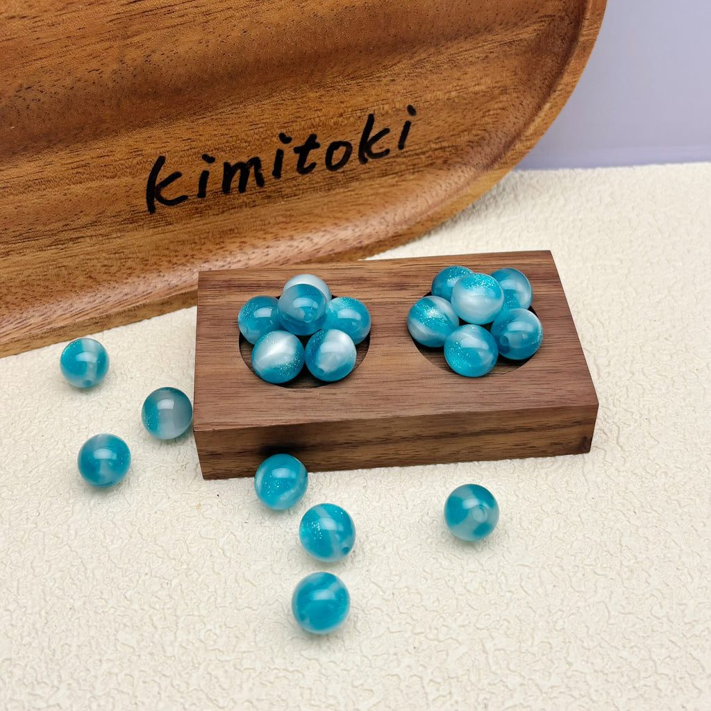 12mm | 紫外線で色が変わるビーズ（アクアブルー→ラベンダー柄）