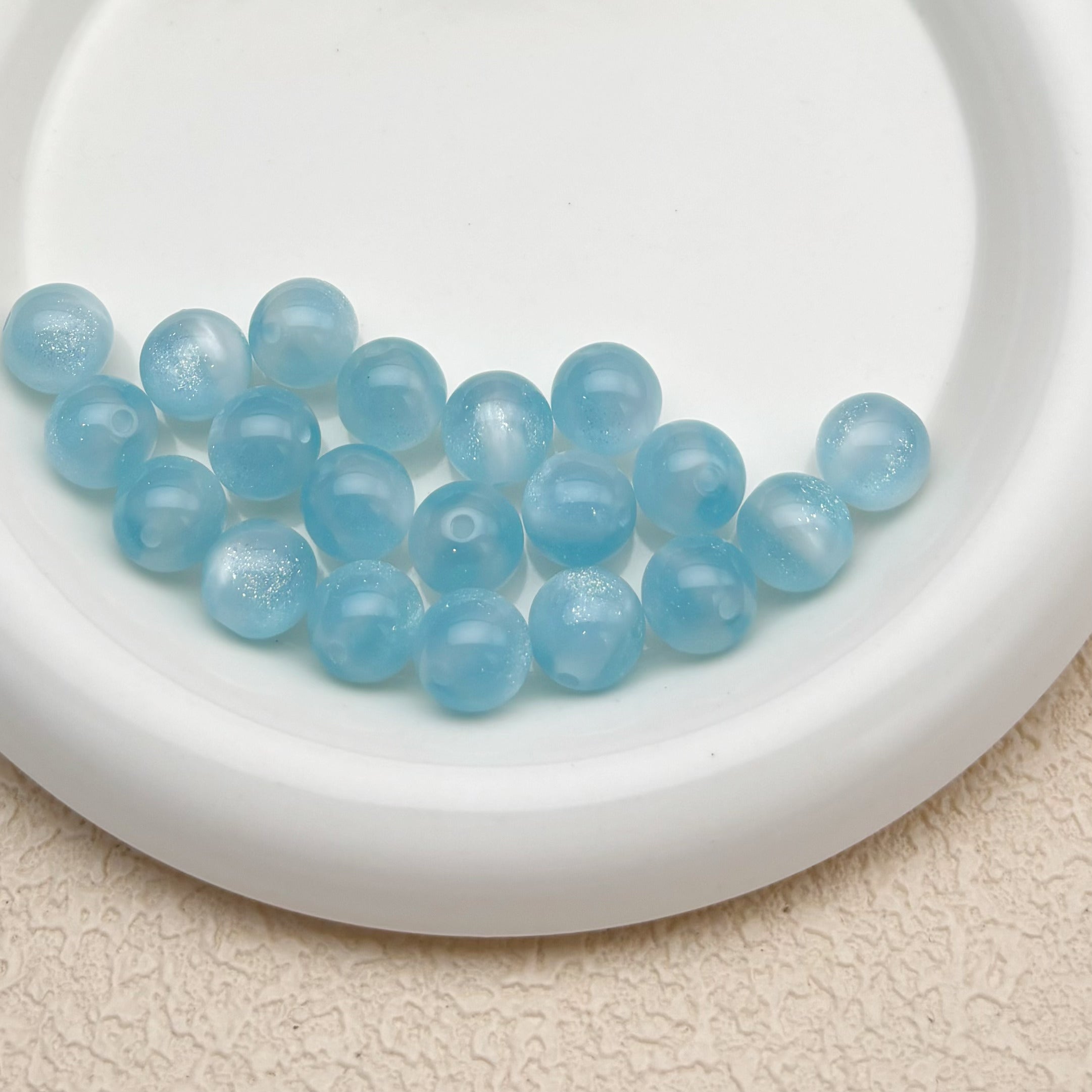 12mm | 紫外線で色が変わるビーズ（スモークブルー→ピンク柄）